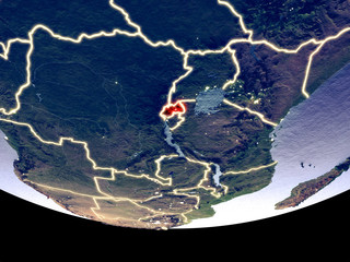 Satellite view of Rwanda from space at night. Beautifully detailed plastic planet surface with visible city lights.