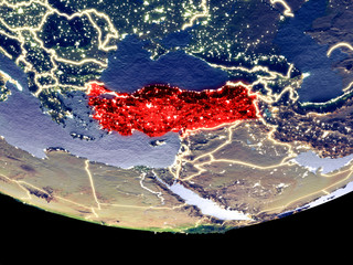 Satellite view of Turkey from space at night. Beautifully detailed plastic planet surface with visible city lights.