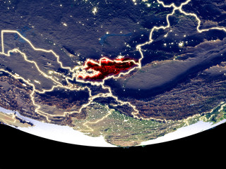 Satellite view of Kyrgyzstan from space at night. Beautifully detailed plastic planet surface with visible city lights.