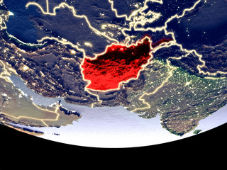 Satellite view of Afghanistan from space at night. Beautifully detailed plastic planet surface with visible city lights.