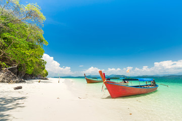 White sand beach and Long-tail boat at Khang Khao Island (Bat island), The beautiful sea Ranong Province, Thailand.