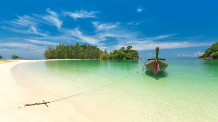White sand beach and Long-tail boat at Kham-Tok Island (koh-kam-tok), The beautiful sea Ranong Province, Thailand.