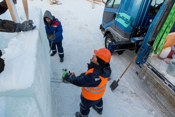 Workers on the installation of the ice town