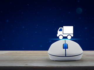 Truck delivery flat icon with wireless computer mouse on wooden table over fantasy night sky and moon, Business transportation online concept