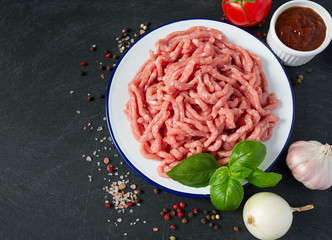 minced meat on black stone surface