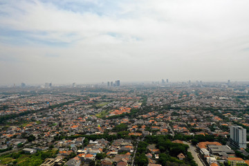 Aerial cityscape modern city Surabaya with skyscrapers, buildings and houses. city skyline with skyscrapers and business centers Surabaya capital city east java, indonesia