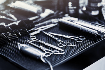 Professional tools of hairdresser in red case. Tools for cutting beard and hair barbershop. - 241673346