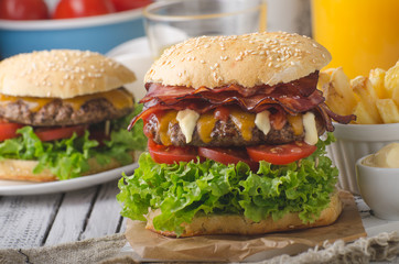 Homemade bacon burger with lettuce and cheddar