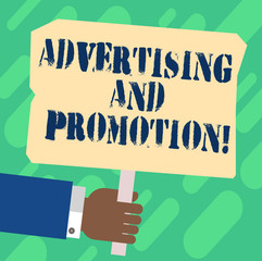 Handwriting text Advertising And Promotion. Concept meaning Actions to stimulate customers to buy right now Hu analysis Hand Holding Blank Colored Placard with Stick photo Text Space