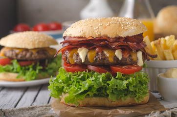 Homemade bacon burger with lettuce and cheddar