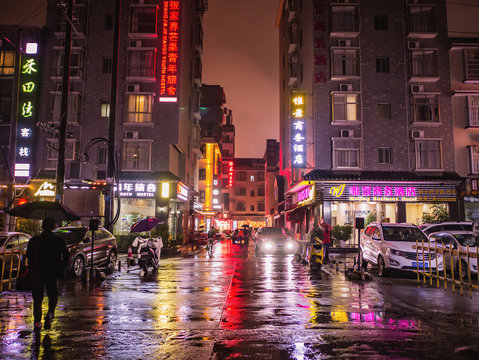 Fototapeta zhangjiajie/China - 13 October 2018:Beautiful city of Zhangjiajie city in the night with the rain in holiday time.sightseeing Building in the night time of zhangjiajie City china