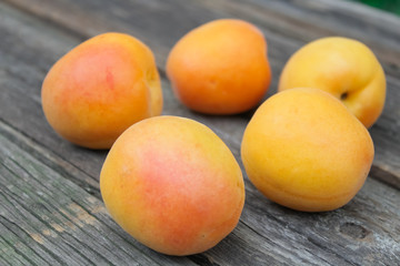 natural, organic apricot on a wooden background