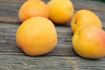 natural, organic apricot on a wooden background
