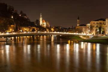 Fototapeta premium Bridge of love and Salzach river in Salzburg, Austria during night