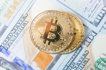 Golden bitcoins on euro,dollar, hryvnia banknotes. Financial background