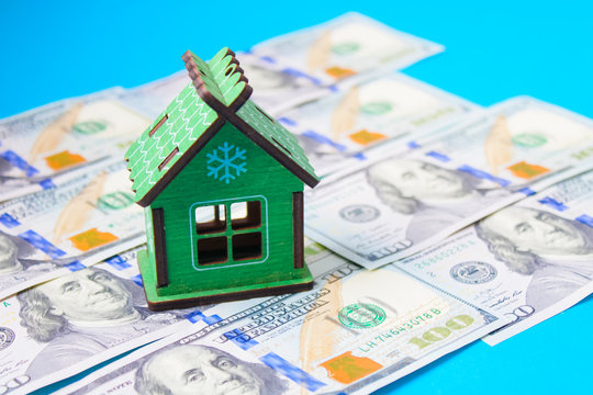 Close up on pile of many bank notes from various countries from around the world. U.S., German, Swiss, Canadian, Brazilian, Vietnamese, Mexican. Many countries represented in currency.