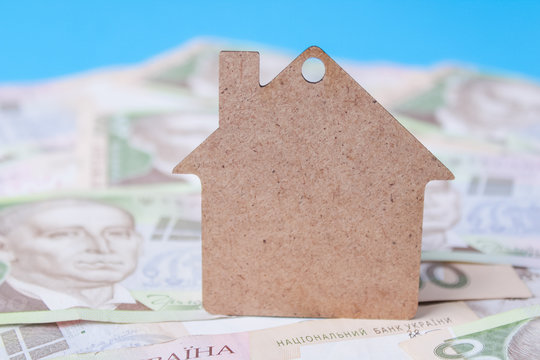 Close up on pile of many bank notes from various countries from around the world. U.S., German, Swiss, Canadian, Brazilian, Vietnamese, Mexican. Many countries represented in currency. - Powered by Adobe
