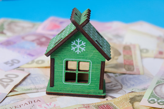 Close up on pile of many bank notes from various countries from around the world. U.S., German, Swiss, Canadian, Brazilian, Vietnamese, Mexican. Many countries represented in currency.