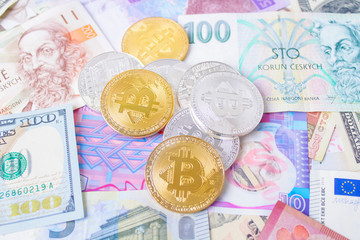 Golden bitcoins on euro,dollar, hryvnia banknotes. Financial background
