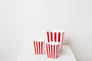 Fototapeta na wymiar Full of popcorn in classic striped box