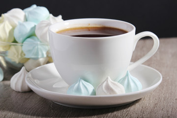 A cup of coffee and meringues for breakfast