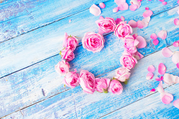 pink roses on wooden background, valentines day