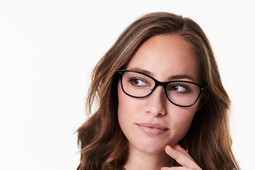 Obraz premium Thoughtful babe in spectacles, looking away