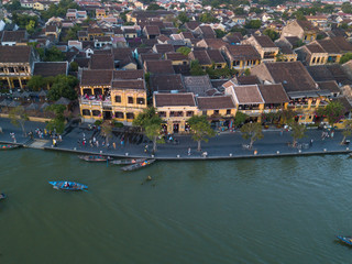 Fototapeta na wymiar Aerial view of Hoi An old town or Hoian ancient town. Royalty high-quality free stock photo image top view of Hoai river and boat traffic Hoi An. Hoi An is one of the most popular travel in asia