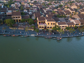 Fototapeta na wymiar Aerial view of Hoi An old town or Hoian ancient town. Royalty high-quality free stock photo image top view of Hoai river and boat traffic Hoi An. Hoi An is one of the most popular travel in asia