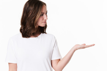 Brunette gesturing in white studio