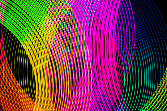 Abstract background of colored red, pink, yellow, green and blue stripes. The concept of geometric aesthetics.