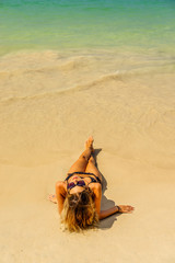 Fototapeta na wymiar Woman on holidays at the beach