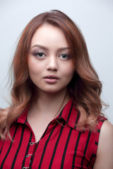 Fototapeta premium Blonde with curly hairstyle and red lips