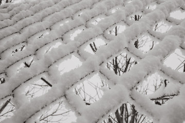 chain-link in the snow, part of the fence