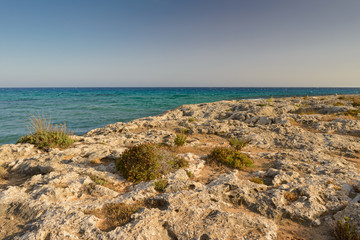 Fototapeta na wymiar rocky shore of the Mediterranean Sea on the island of Cyprus at sunset