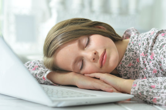 Little girl in pajama sleeping on couch