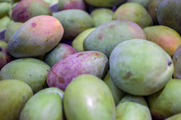 mango and pittahaya on the shelves of the Asian market