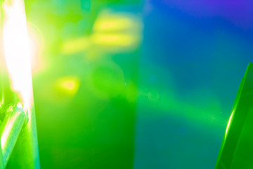 Abstract green and yellow background in blue spotlight
