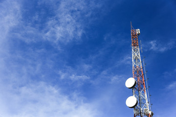 Signal towers with a cloudy sky
