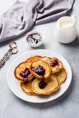 Cottage cheese pancakes with jam and tea. Concept healthy Breakfast.