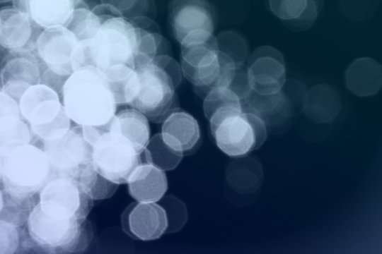bokeh effect of painted spots on black texture - fantastic abstract photo background