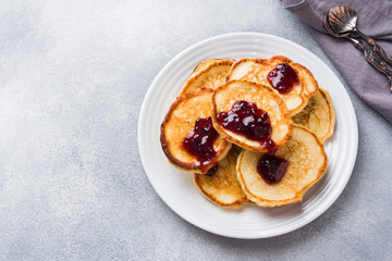 Cottage cheese pancakes with jam and tea. Concept healthy Breakfast.