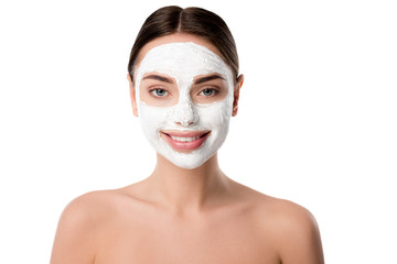 smiling nude woman with facial skin care mask isolated on white
