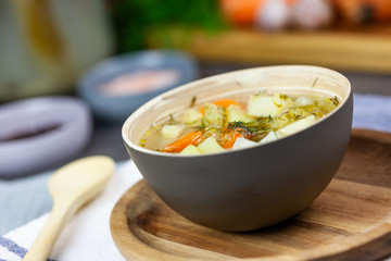 Cucumber soup made of pickled cucumbers with vegetables in the background