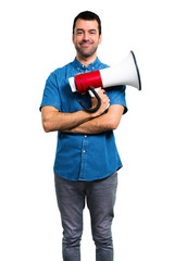 Handsome man with blue shirt holding a megaphone