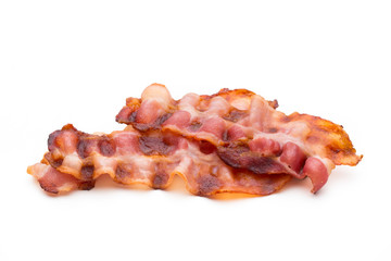 Cooked bacon rashers isolated on white.