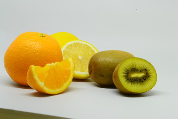 Kiwi and orange fruit isolated on white background