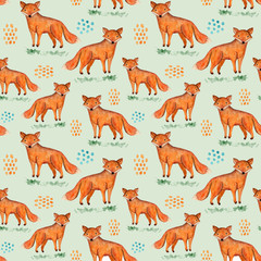 Obraz premium Cute watercolor seamless pattern with orange fox, grass and blue and ginger stains on green background. Funny hand drawn foxy texture for print design, wallpaper, textile, wrapping paper