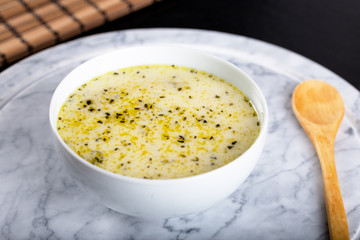 Traditional yayla soup (yoghurt soup) on wooden background