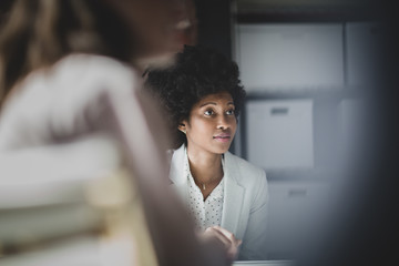African American businesswoman listening in a meeting